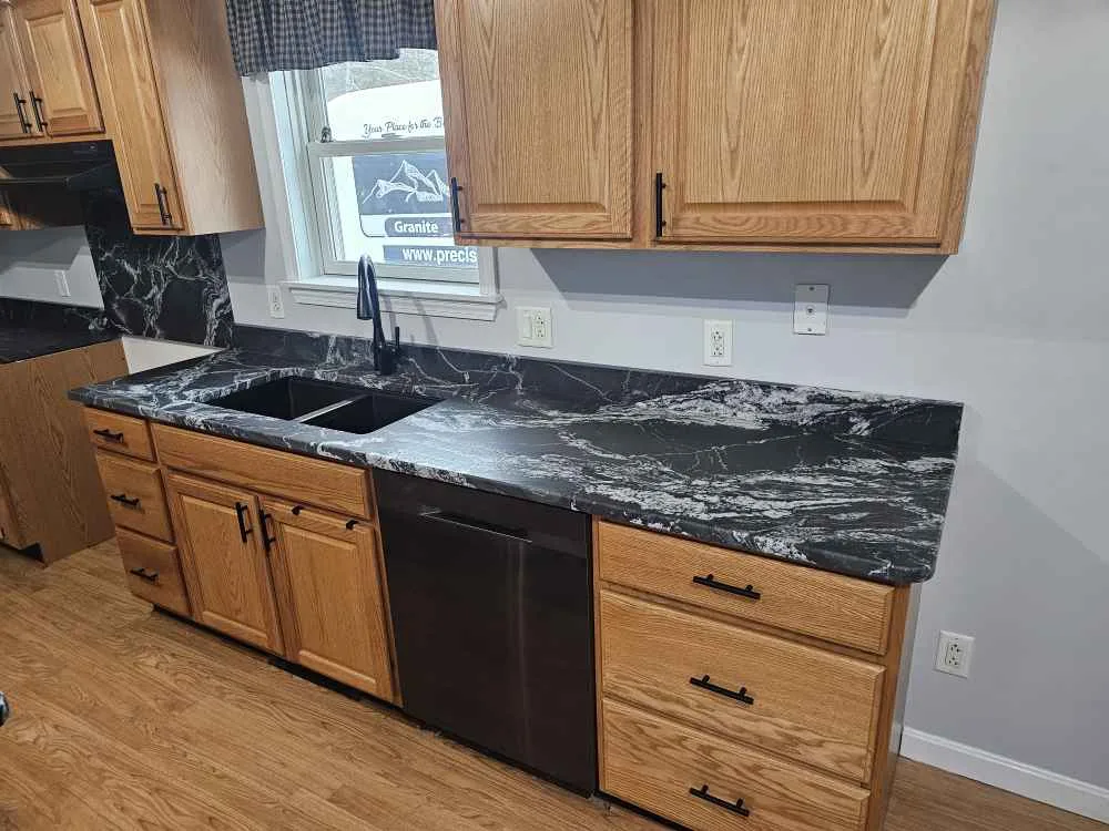 Black Forest leathered granite kitchen countertop in a Pittsfield, New Hampshire home