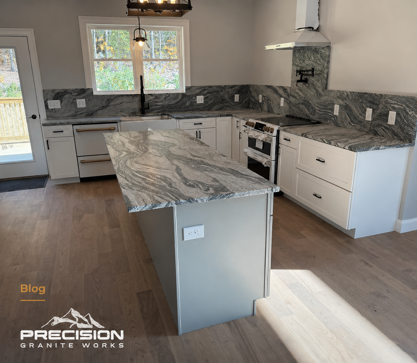 Full-height natural stone backsplash behind a kitchen range in a New Hampshire home