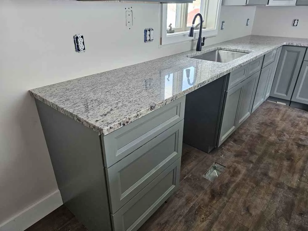 Granite countertops with undermount sink installed in a new kitchen in New Hampshire