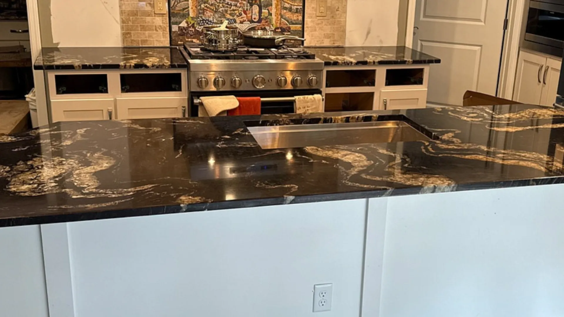 Custom granite countertops with dramatic veining installed in a New Hampshire kitchen