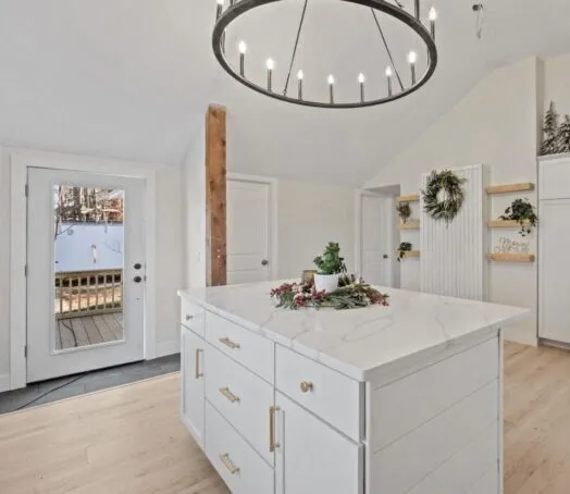 White quartz kitchen island with a fabricated waterfall edge in a New Hampshire home