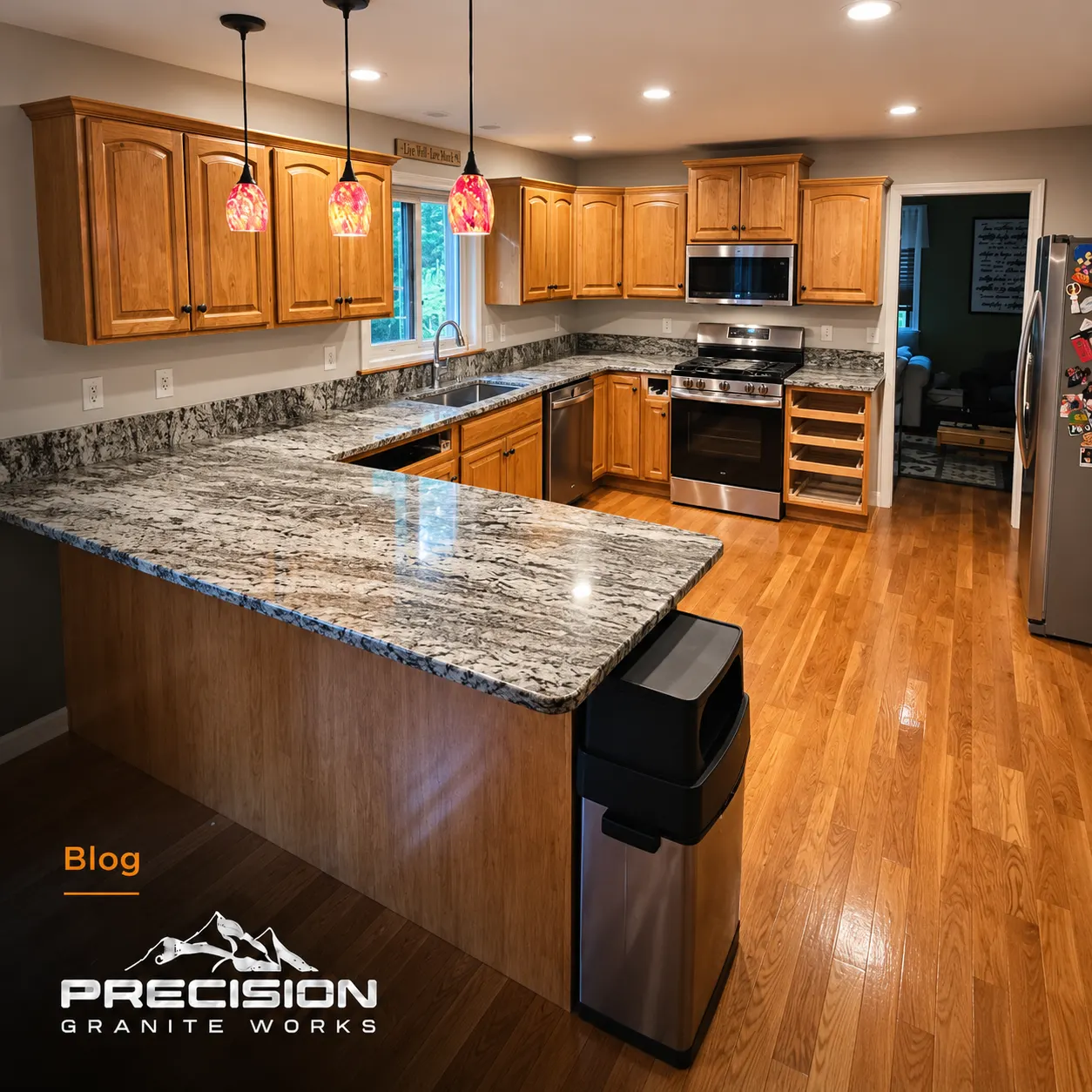 Kitchen with a natural stone island countertop and a quieter contrasting perimeter countertop