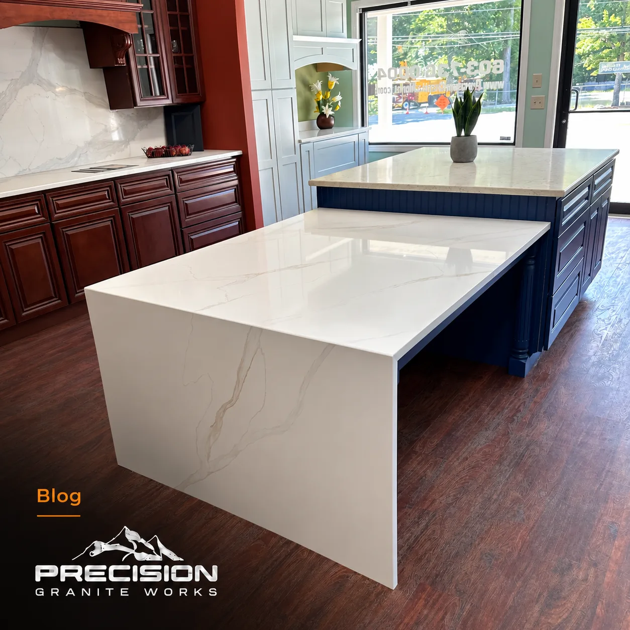 Quartz waterfall kitchen island with carefully aligned veining at the mitered corner